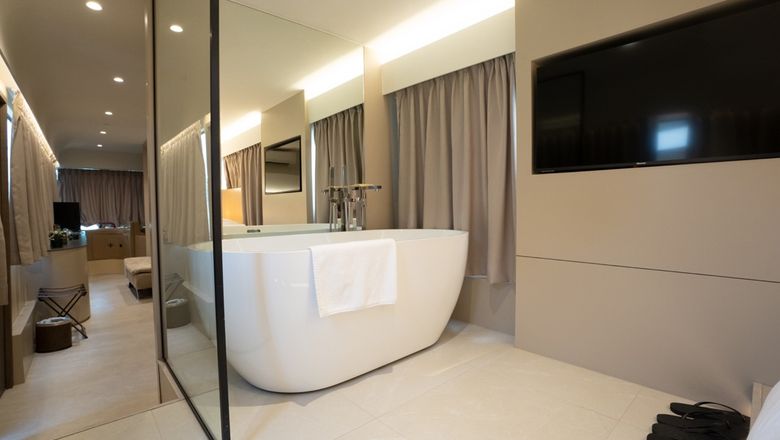 Guest rooms on the converted buses include rain showers, beds and bathtubs.
