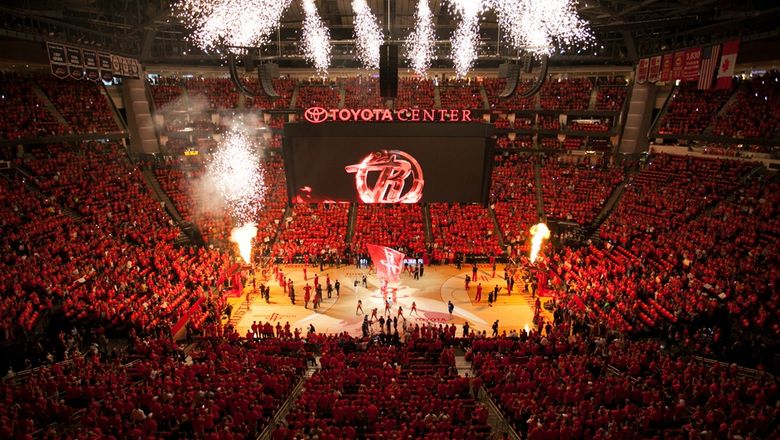 The Post Oak Hotel experience includes courtside Houston Rockets seats, penthouse access, wine dinner, spa treatments, and helicopter transfers.
