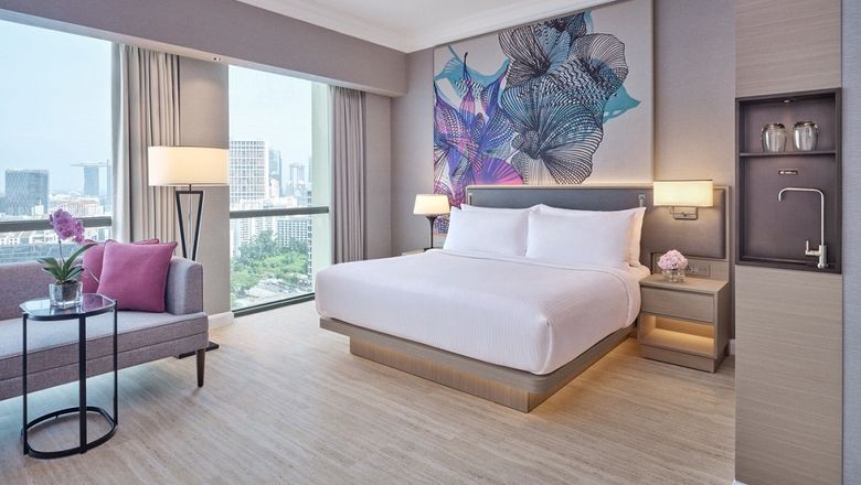 Grand Copthorne Waterfront Hotel's sustainable guestroom features include in-room water filtration, smart thermostats, wireless charging, and high-definition smart TVs.