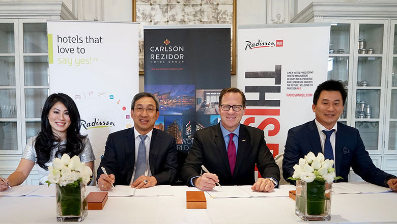 From left, Jeani Kantono, director, Saphir Group, Pak Djoni Kantono, chairman, Saphir Group, David P. Berg, CEO, Carlson Hospitality Group and James Kantono, director, Saphir Group.
