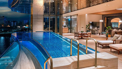 Capella penthouses feature private balconies with infinity-edge pools and panoramic views of Macao.