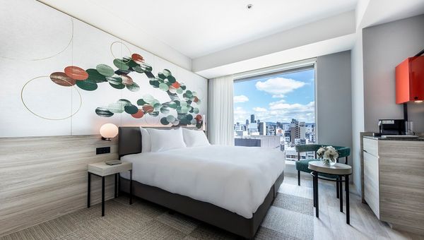 All rooms feature floor-to-ceiling windows looking out over the city.
