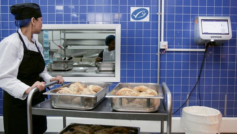 A kitchen with a Winnow Vision system, which uses cameras and artificial intelligence to evaluate discarded food, then analyses and attaches a cost to the food that was wasted.
