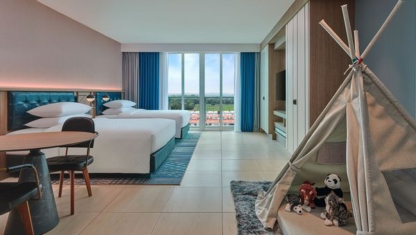 The family room comes equipped with Wi-Fi, a workspace, a private balcony, play tent and children’s amenities. The family room comes equipped with Wi-Fi, a workspace, a private balcony, play tent and children’s amenities.