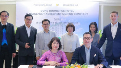 Fusion and Dong Duong executives are all smiles after management agreement.