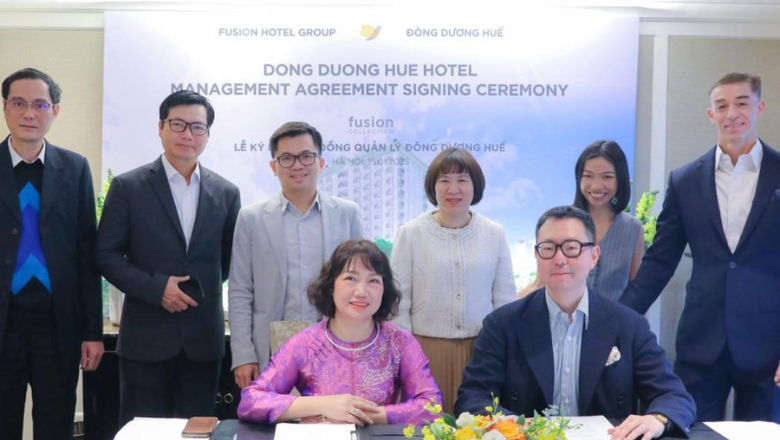 Fusion and Dong Duong executives are all smiles after management agreement.