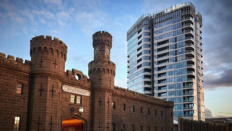 The Adina Apartment Hotel rises above one of Melbourne’s most infamous prisons, now decommissioned.