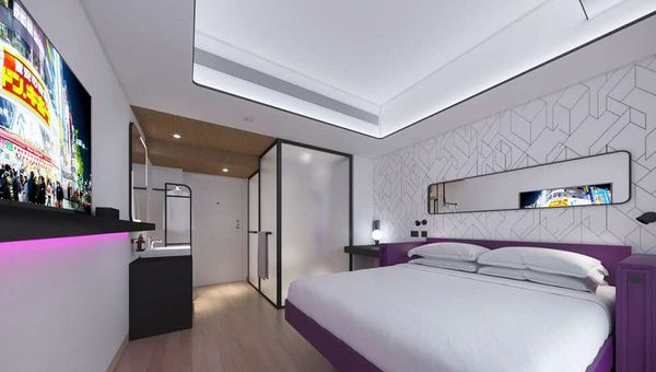 Yotel’s smart beds converts from a fully flatbed to a sofa with the touch of a button. Yotel’s smart beds converts from a fully flatbed to a sofa with the touch of a button.