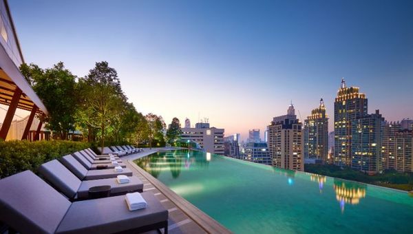 Outdoor infinity pool with views of Bangkok skyline. Outdoor infinity pool with views of Bangkok skyline.