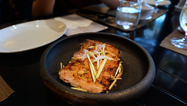 Seared pork cheek with julienned green mango and onions