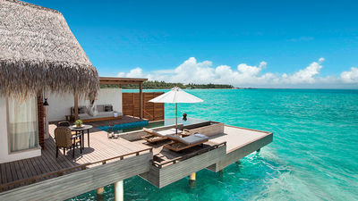 An overwater villa with its private pool at Fairmont Maldives Sirru Fen Fushi.