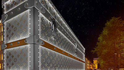 Iconic Louis Vuitton monogrammed trunk facade now adorns Paris building amid luxury hotel renovation rumours.