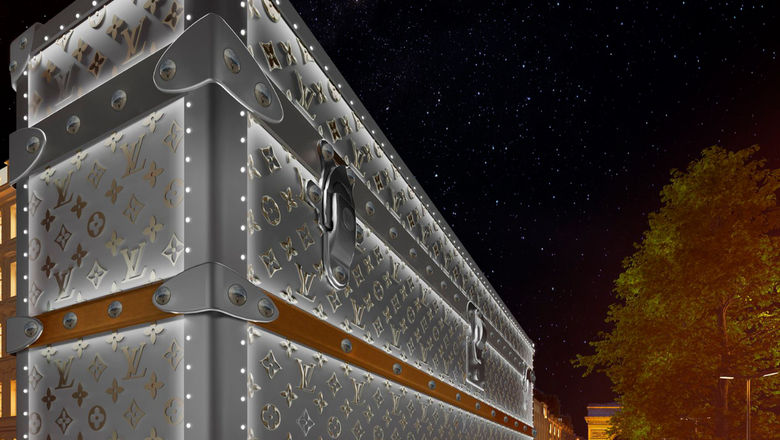 Iconic Louis Vuitton monogrammed trunk facade now adorns Paris building amid luxury hotel renovation rumours.