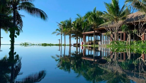 The Anam Mui Ne, part of Small Luxury Hotels of the World, features 127 rooms, French villa-inspired design, pools, spa, and Vietnamese cultural charm.