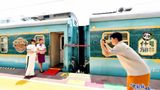 Providing a cultural experience at the Anjing railway station in Chengdu.