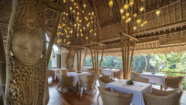 The restaurant encompasses two levels overlooking the rice fields, jungle, and the infinity pool. The restaurant encompasses two levels overlooking the rice fields, jungle, and the infinity pool.