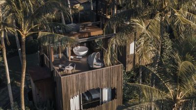 This treehouse villa in Bali shrouded by coconut trees offers a secluded hideaway for couples looking to escape the hustle and bustle of city life.
