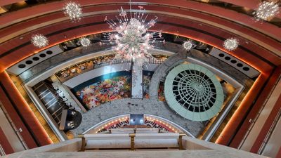Blending Singapore's diverse heritage with contemporary design, the hotel integrates intricate Peranakan motifs and floral elements into its public spaces, featuring glass chandeliers reminiscent of bouquets and carpets adorned with abstract flower prints.