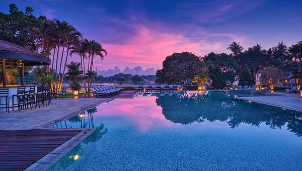 Azerai La Residence's 40-meter salt-water pool, located on the garden's far side with river views, is surrounded by shaded sun loungers. Azerai La Residence's 40-meter salt-water pool, located on the garden's far side with river views, is surrounded by shaded sun loungers.
