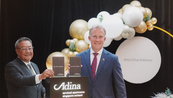 Far East Hospitality CEO Arthur Kiong (left) with Australian High Commissioner to Singapore Will Hodgman perform a symbolic "check in" to mark the official opening of Adina Serviced Apartments Singapore Orchard.
