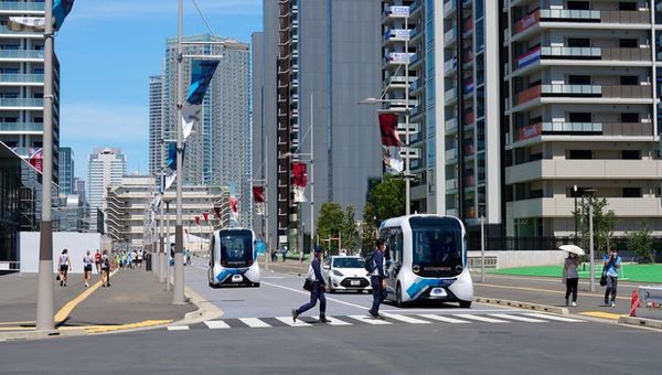 Automated buses circle the Olympic Village and can drop athletes off at nine different stops.