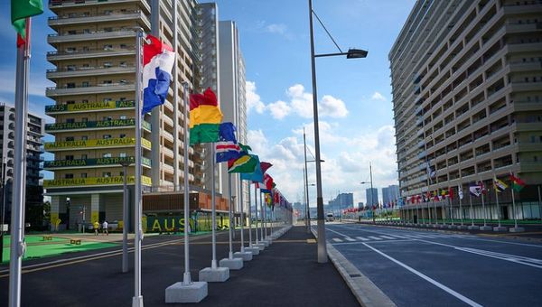 Flag poles in the Olympic Village have been shortened to allow for better photos with the flags.