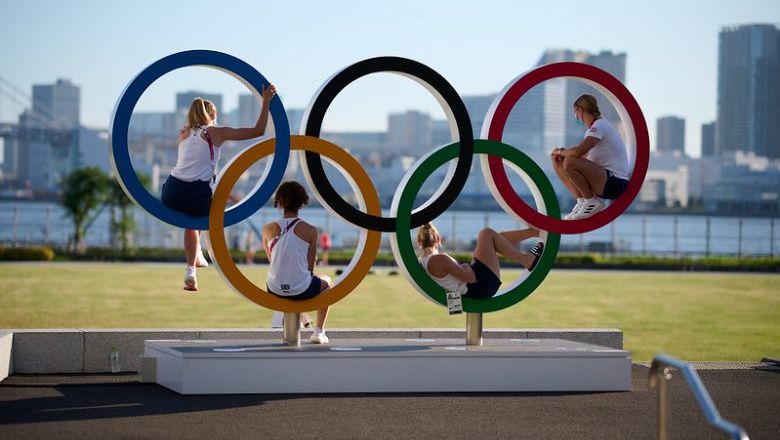 A set of Olympic rings is a popular outdoor gathering spot for athletes.