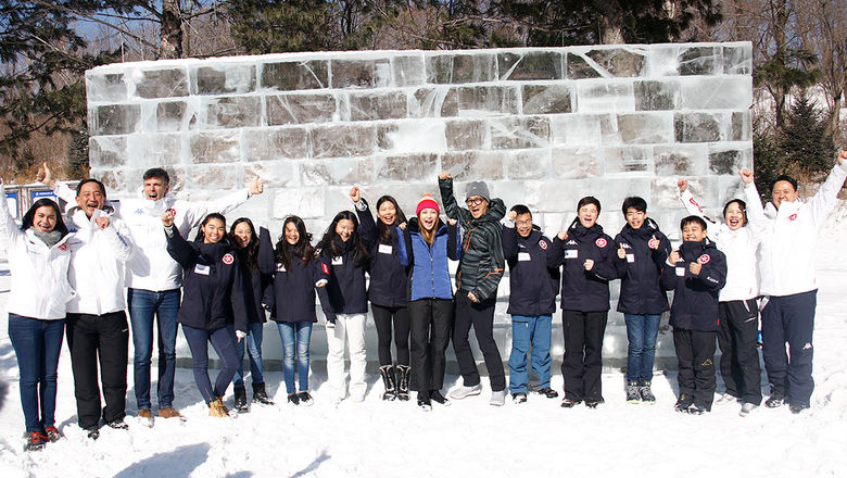 Goodwill ambassadors Cindy Lee and Gilbert Lam, HK Ski Association members raise a cheer during the inaugural training session with the first HK Ski team at Club Med Yabuli in China.