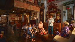 Alvin Yapp (standing) sharing stories with visitors to The Intan.