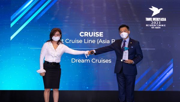 President of Dream Cruises Michael Goh receiving the awards for Best Cruise Line - Asia Pacific and Best Cruise Line - Sales and Services.
