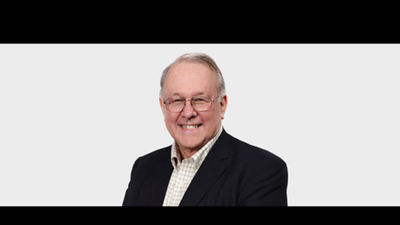 Bob Guy, a travel industry leader who set standards "and tirelessly gave of himself".