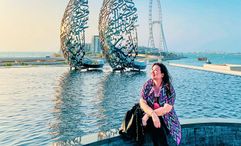 Pauline Suharno enjoying the calligraphic sights, including The Sail sculpture, in Dubai.