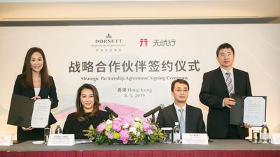 Deal done: Winnie Chiu, president & executive director of DHI, and Dr. Ji Yong, general manager of platform business of China Mobile International Ltd, after the signing.