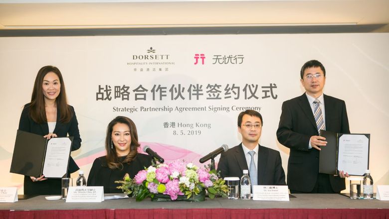 Deal done: Winnie Chiu, president & executive director of DHI, and Dr. Ji Yong, general manager of platform business of China Mobile International Ltd, after the signing.