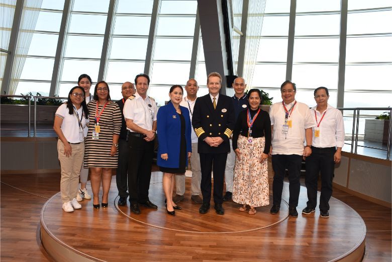 Captain Flemming Nielsen (centre) with Filipino government and corporate delegates as well as Spectrum of the Seas' directors