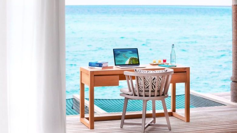 Amid corporates’ growing comfort with flexible work arrangements, more professionals are combining business and leisure travel to work from hotels — or anywhere. Pictured: Vakkaru Maldives Over Water Pool Villa