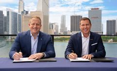 Jason Liberty, chairman and CEO of Royal Caribbean Group, and Adam Stewart, executive chairman of Sandals Resorts, mark the signing of an agreement of the landmark partnership.