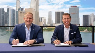 Jason Liberty, chairman and CEO of Royal Caribbean Group, and Adam Stewart, executive chairman of Sandals Resorts, mark the signing of an agreement of the landmark partnership.