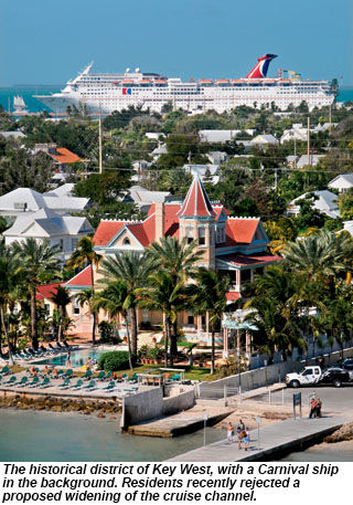 The historical district of Key West, with a Carnival ship in the background.