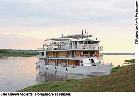 The Queen Violetta, alongshore at sunset.