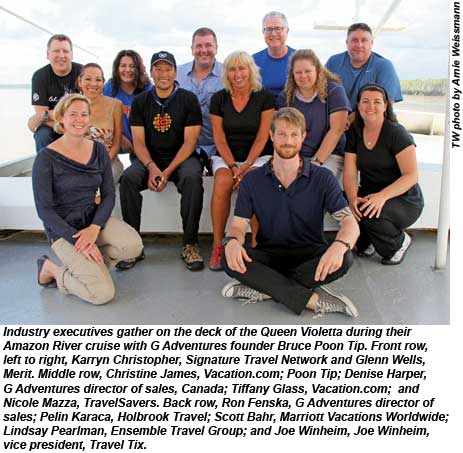 Industry executives gather on the deck of the Queen Violetta during their Amazon River cruise with G Adventures founder Bruce Poon Tip.