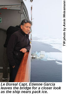 Le Boreal Capt. Etienne Garcia leaves the bridge for a closer look as the ship nears pack ice.