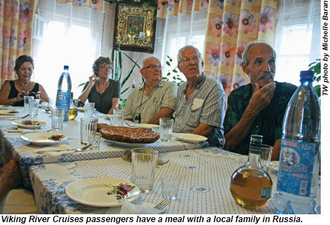 Viking River Cruises passengers have a meal with a local family in Russia.