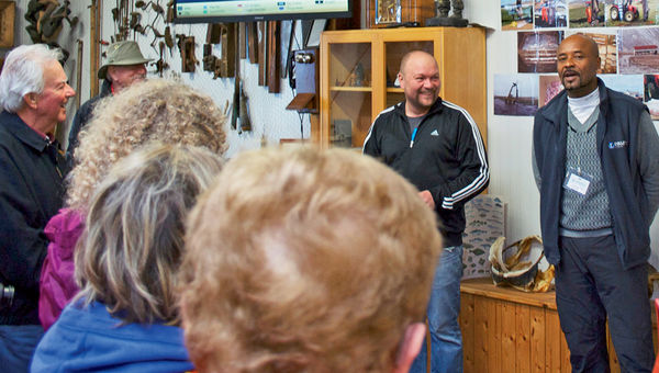 Geoff Harrison, a Collette tour guide, uses a smartphone and tablet to help with tour logistics along the way.