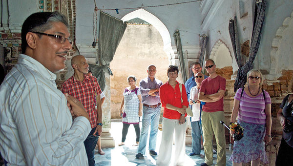 A tour guide on India’s Ganges River captivates travelers with stories and in-depth knowledge about India’s rich religious traditions.