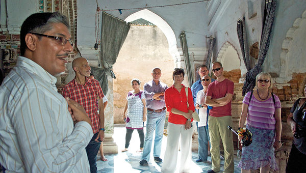 A tour guide on India’s Ganges River captivates travelers with stories and in-depth knowledge about India’s rich religious traditions. A tour guide on India’s Ganges River captivates travelers with stories and in-depth knowledge about India’s rich religious traditions.