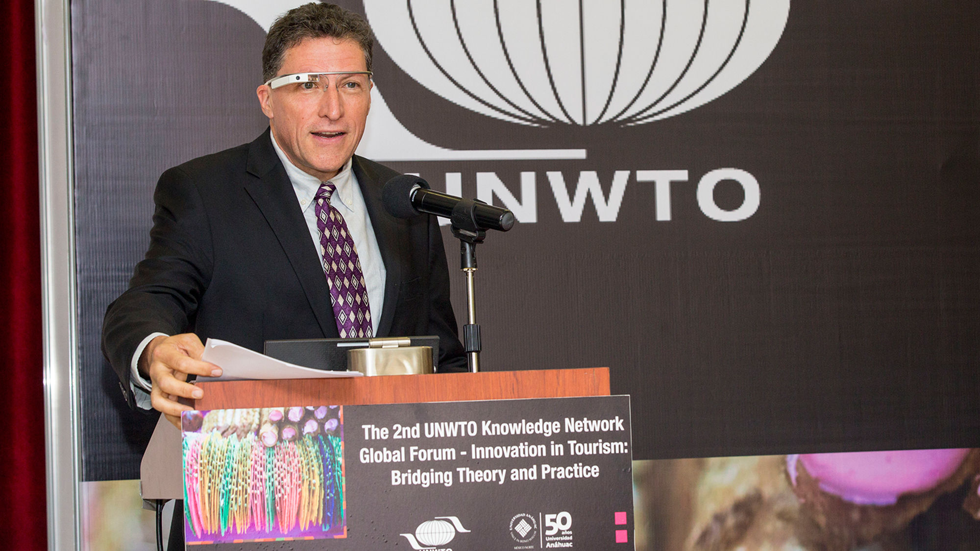 Travel Weekly editor in chief Arnie Weissmann wears Google Glass as he speaks about innovation in tourism at the University of Anahuac in Mexico City last May.