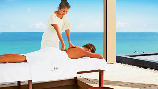 A massage at the Cheval Blanc Randheli resort on the Noonu Atoll, in the Maldives.