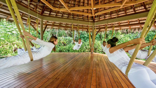 An AntiGravity Yoga session at the Four Seasons Maldives at Landaa Giraavaru.