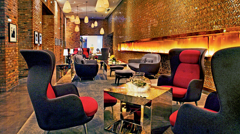 A steady climb in visitors has sparked a flurry of hotel development in Chicago as hoteliers introduce brands with a predominantly overseas presence or try out entirely new concepts. Pictured here, the lobby of the Radisson Blu Aqua.